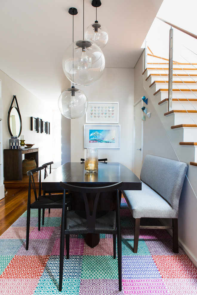 Small eclectic dining room in Sydney with no fireplace.