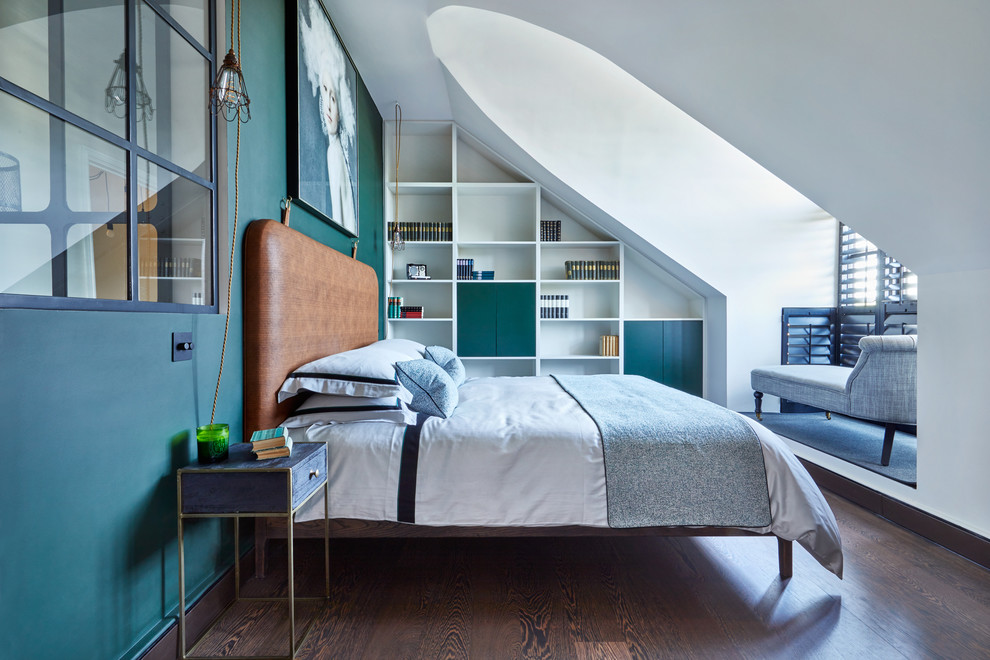 Mid-sized contemporary master bedroom in London with dark hardwood floors, brown floor and green walls.