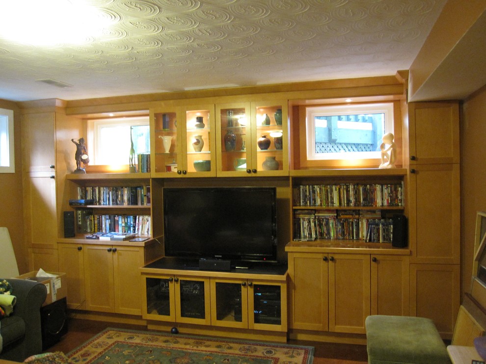 Inspiration for a mid-sized transitional look-out medium tone wood floor and brown floor basement remodel in Toronto with beige walls and no fireplace