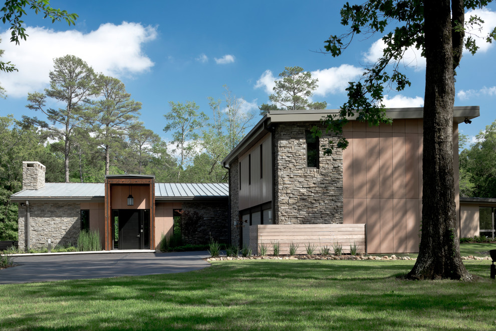 This is an example of a contemporary brown exterior in Dallas.