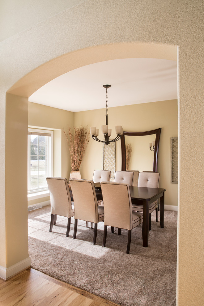 Enclosed dining room - mid-sized transitional carpeted enclosed dining room idea in Milwaukee with beige walls and no fireplace