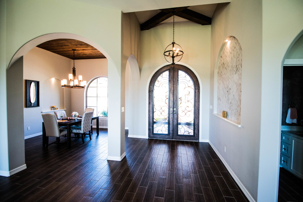 Inspiration for a mid-sized transitional medium tone wood floor and brown floor foyer remodel with gray walls and a brown front door