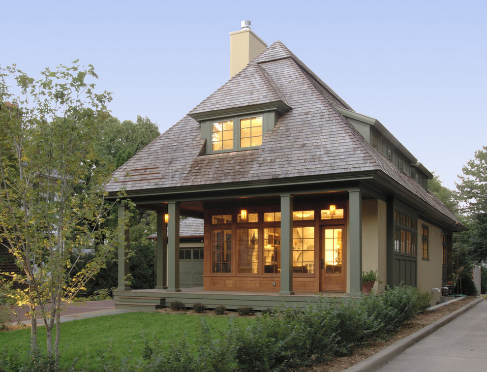 Design ideas for a mid-sized traditional two-storey exterior in Minneapolis with a hip roof.