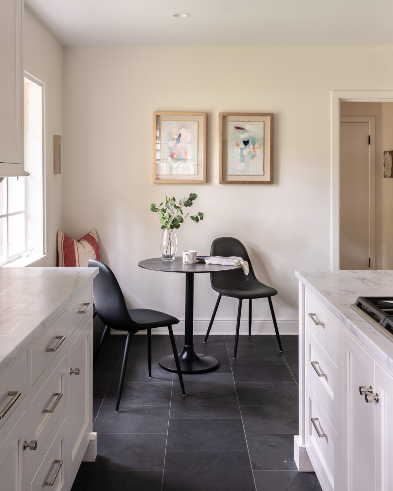 Example of a mid-sized transitional l-shaped cement tile floor and gray floor eat-in kitchen design with a drop-in sink, shaker cabinets, white cabinets, quartzite countertops, gray backsplash, porcelain backsplash, stainless steel appliances, an island and multicolored countertops