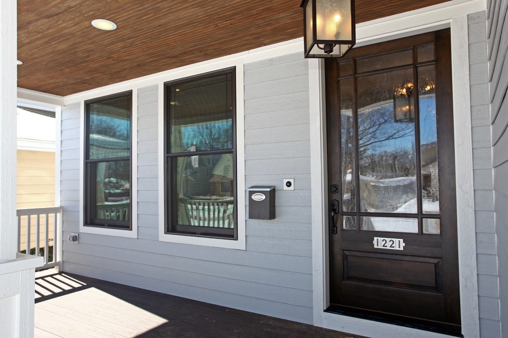 Mid-sized transitional front door photo in Chicago with gray walls and a dark wood front door