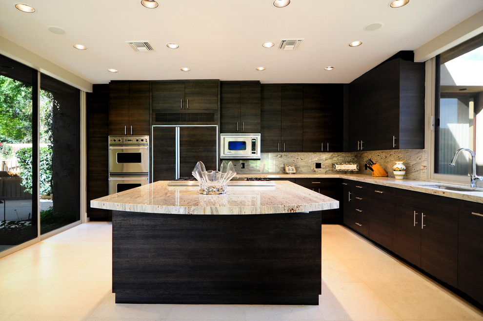Photo of an expansive modern l-shaped eat-in kitchen in Other with an undermount sink, flat-panel cabinets, black cabinets, solid surface benchtops, multi-coloured splashback, stone slab splashback, stainless steel appliances, ceramic floors and with island.