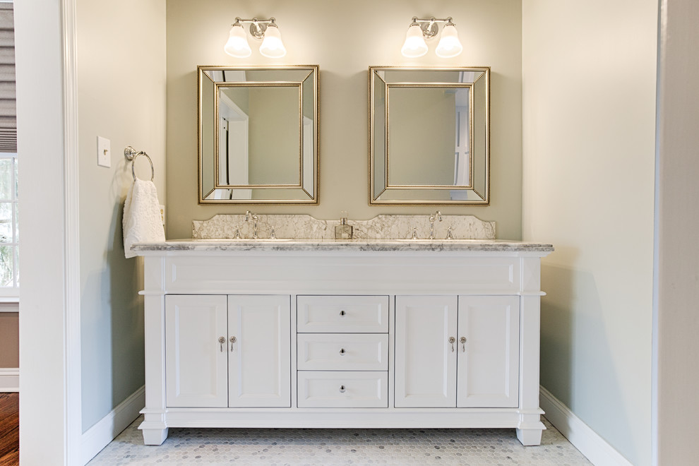 Photo of a mid-sized traditional master bathroom in Philadelphia with furniture-like cabinets, white cabinets, multi-coloured tile, mosaic tile, beige walls, mosaic tile floors, an undermount sink, marble benchtops, an alcove shower and a hinged shower door.