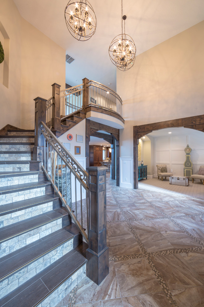 Large arts and crafts wood curved staircase in Salt Lake City with tile risers.