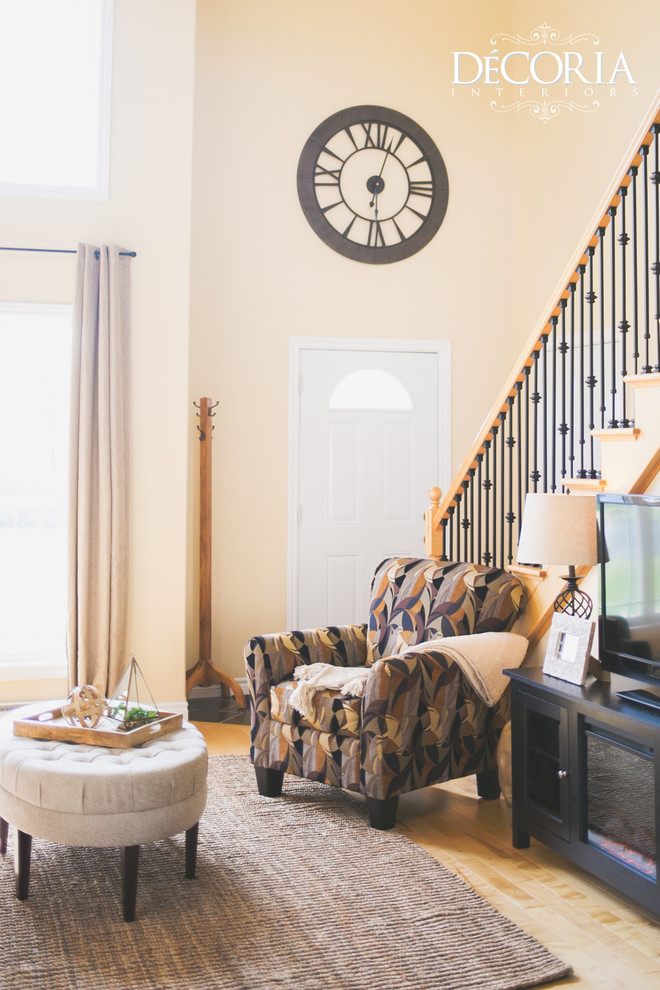 Inspiration for a small transitional formal and open concept light wood floor and beige floor home design remodel with beige walls, a standard fireplace and a tv stand