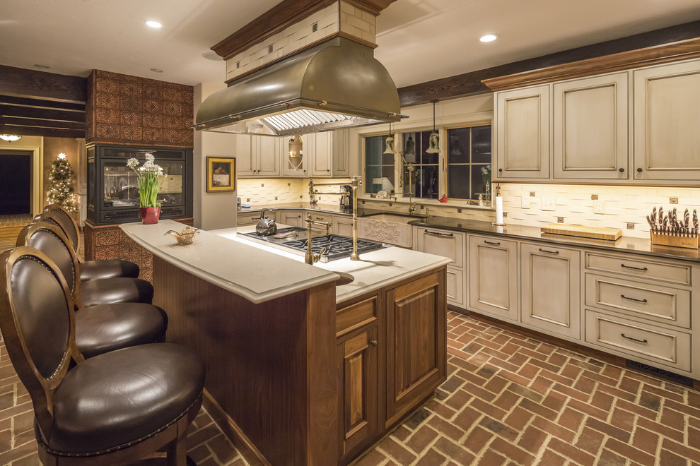 Photo of a large country u-shaped eat-in kitchen in Boston with a farmhouse sink, beaded inset cabinets, white cabinets, granite benchtops, white splashback, marble splashback, panelled appliances, with island and red floor.