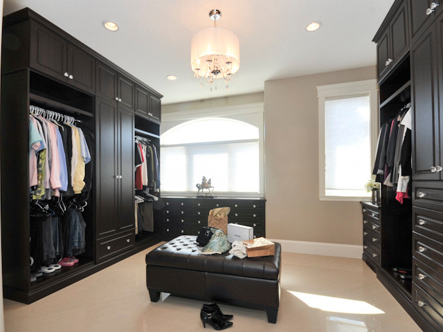 Design ideas for a contemporary dressing room in Edmonton with flat-panel cabinets, black cabinets and carpet.