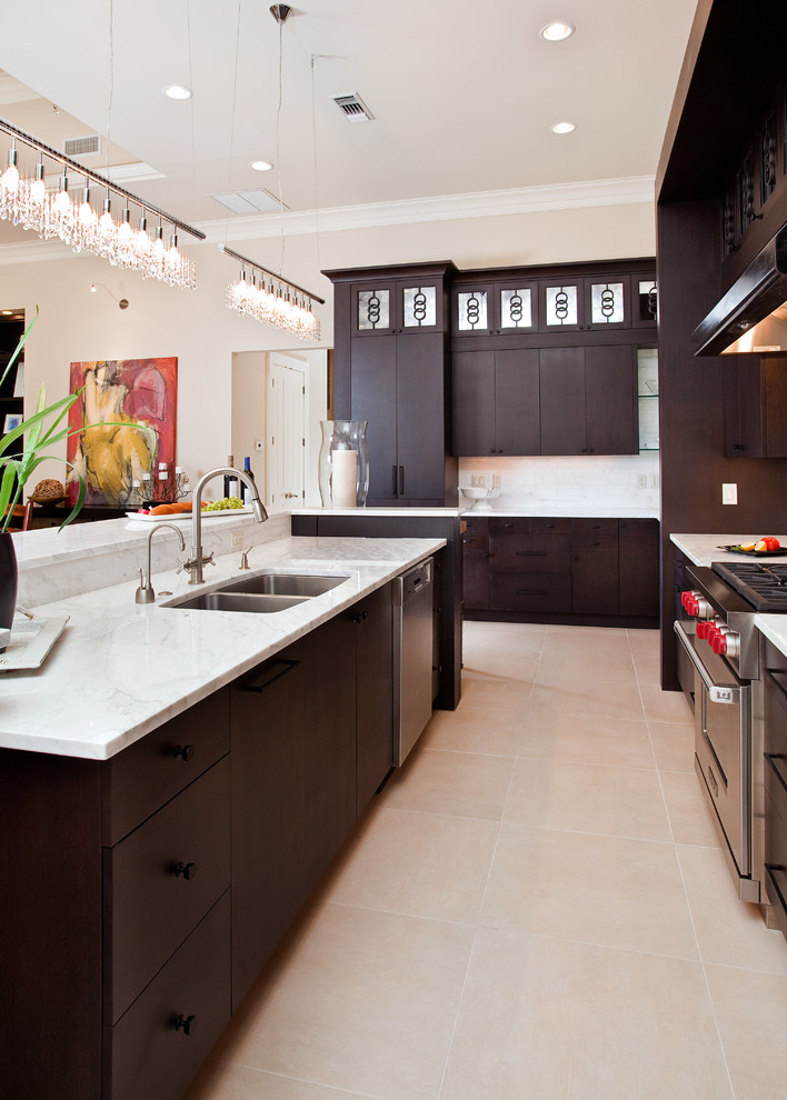 Inspiration for a contemporary kitchen in Miami with a double-bowl sink, stainless steel appliances, marble benchtops, flat-panel cabinets, dark wood cabinets and marble splashback.