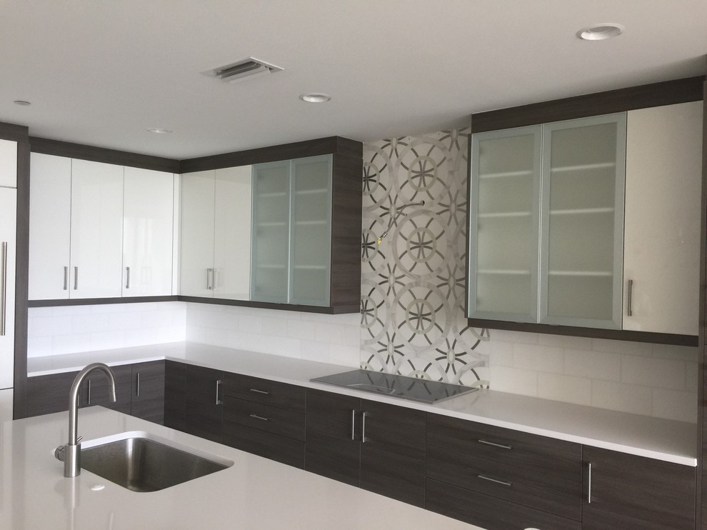 Large tuscan single-wall enclosed kitchen photo with a double-bowl sink, marble backsplash and stainless steel appliances