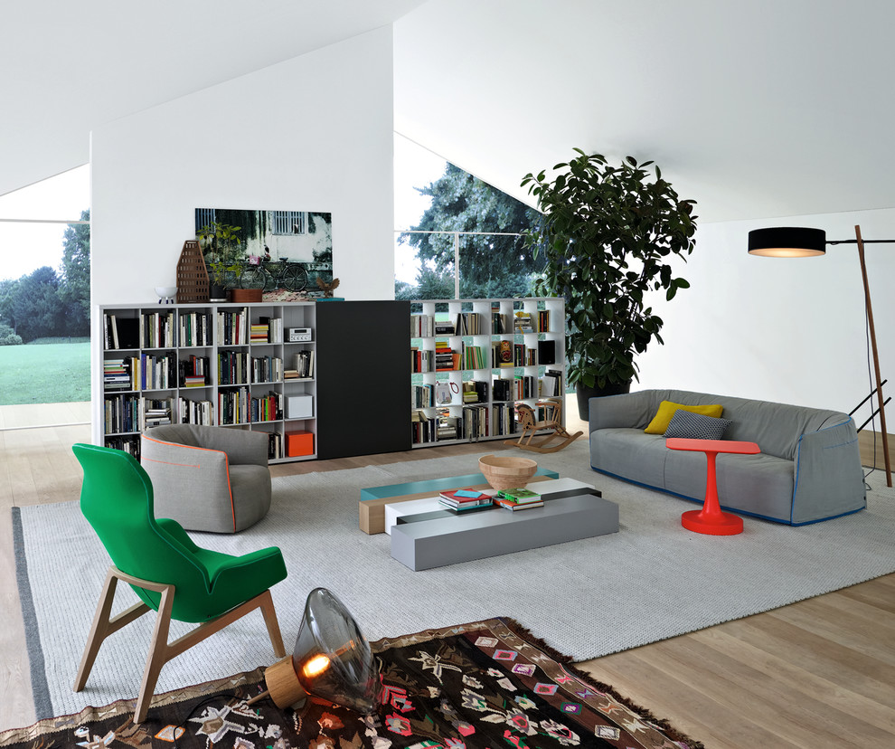 Inspiration for a large scandinavian open concept living room in Sydney with white walls and light hardwood floors.