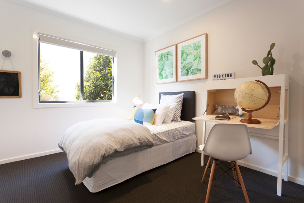 This is an example of a contemporary gender-neutral kids' bedroom for kids 4-10 years old in Melbourne with white walls, carpet and black floor.
