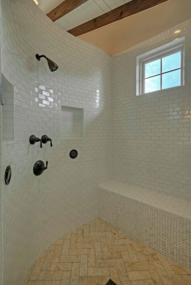 This is an example of a country master bathroom in Austin with an open shower, white tile and ceramic tile.