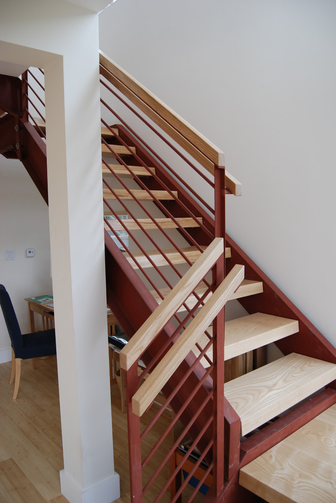 Contemporary wood floating staircase in San Francisco with open risers.