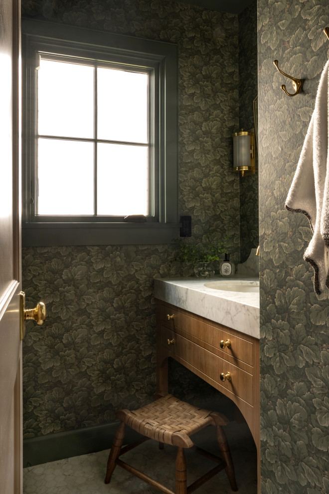 Inspiration for a small timeless marble floor, white floor and wallpaper powder room remodel in Seattle with green walls, an undermount sink, marble countertops, white countertops and a built-in vanity