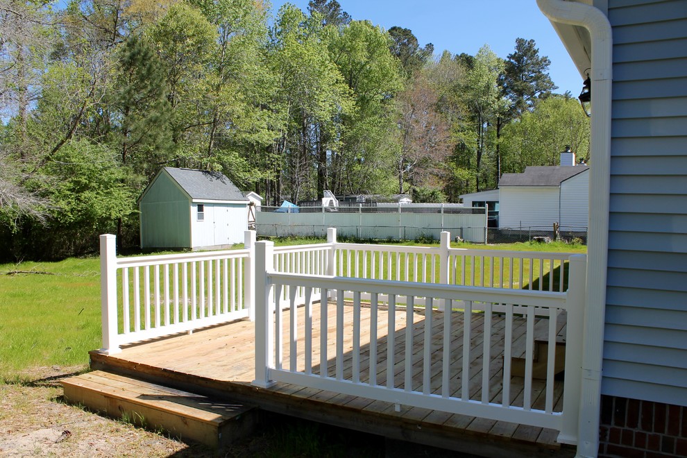 Mid-sized arts and crafts backyard deck photo with no cover