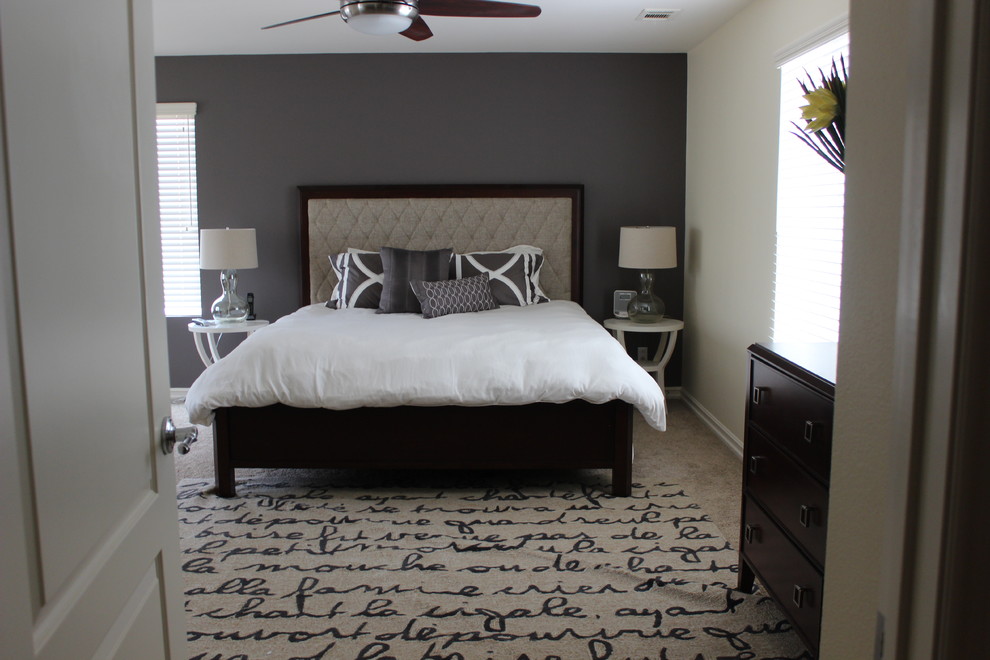 Photo of a contemporary master bedroom in San Diego with grey walls and carpet.