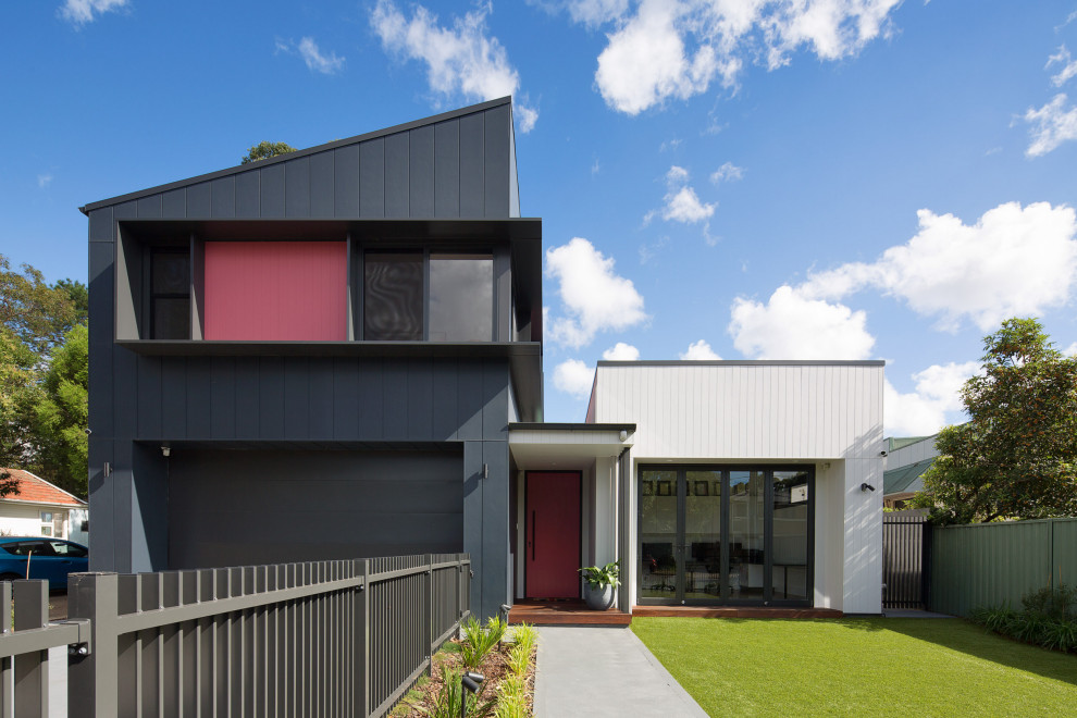 Design ideas for a contemporary two-storey blue house exterior in Sydney with concrete fiberboard siding, a metal roof and a black roof.