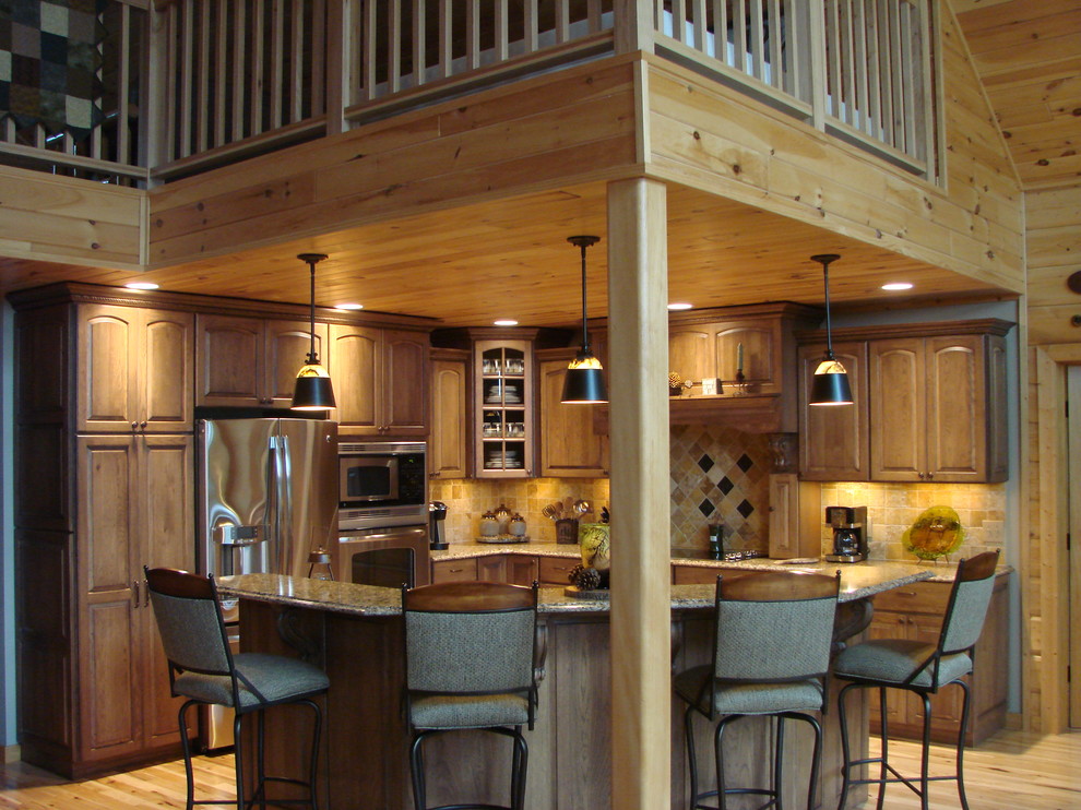 Inspiration for a small rustic l-shaped light wood floor enclosed kitchen remodel with raised-panel cabinets, beige cabinets, granite countertops, porcelain backsplash, stainless steel appliances and an island