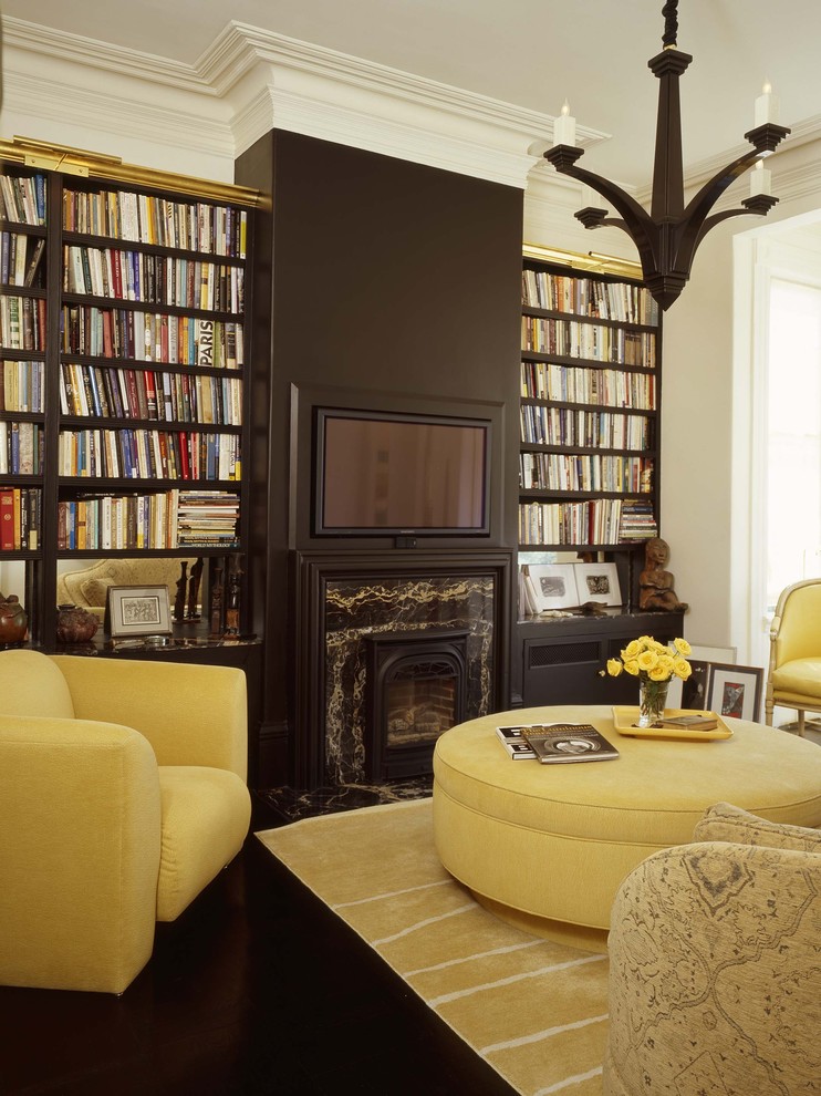 Photo of an eclectic living room in Other with a library.