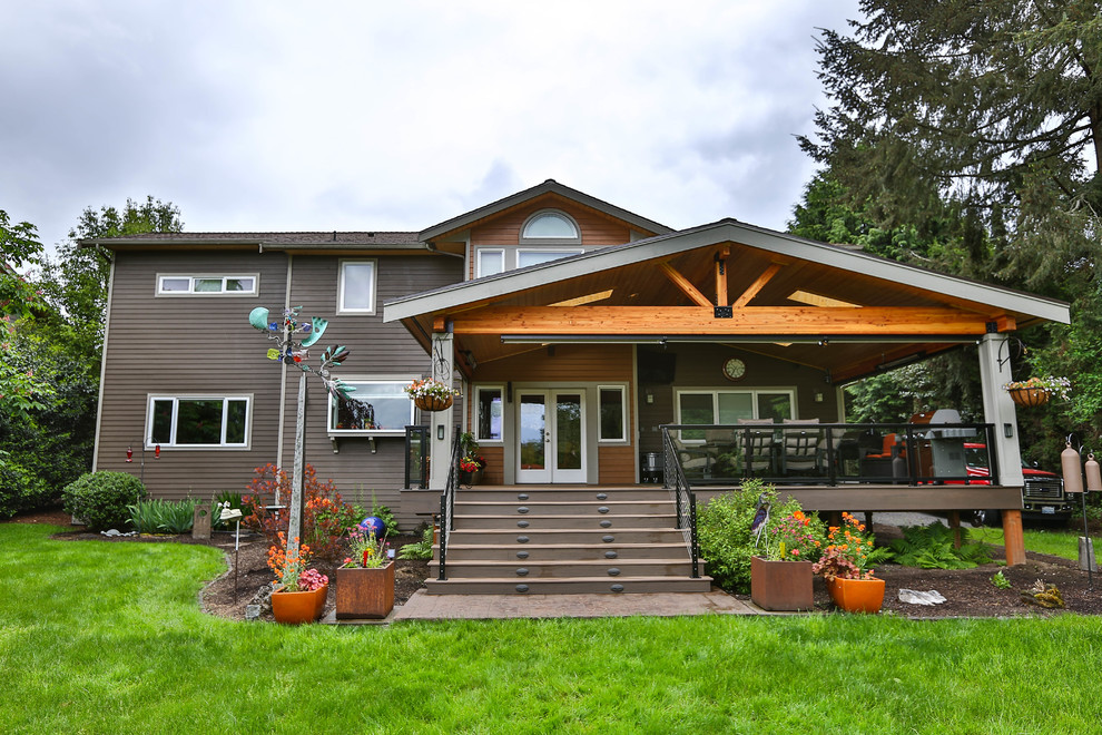 Inspiration for a large rustic two-story wood brown deck remodel in Seattle with a hip roof and a shingle roof