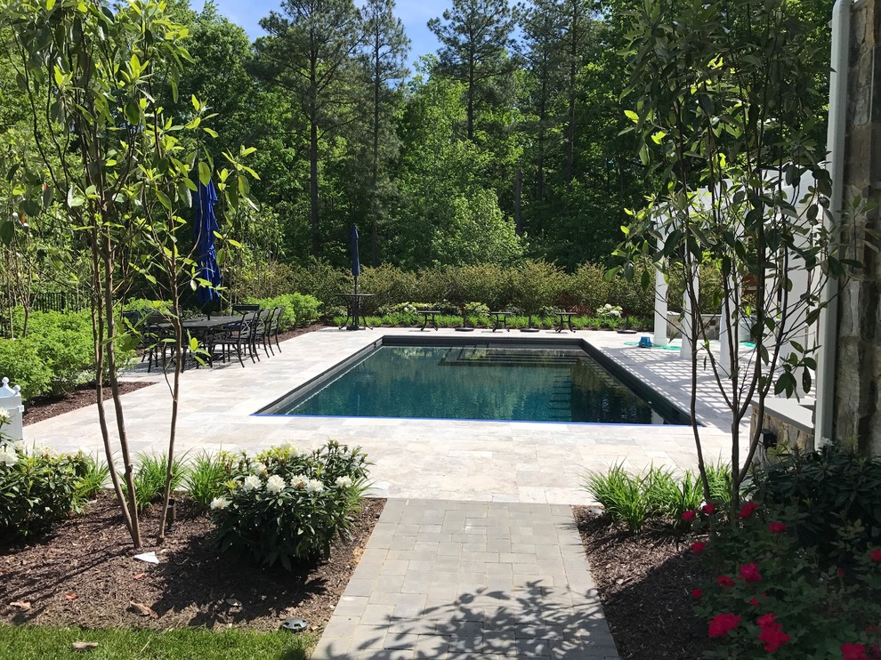 Inspiration for a huge transitional backyard stone and rectangular natural pool remodel in Richmond