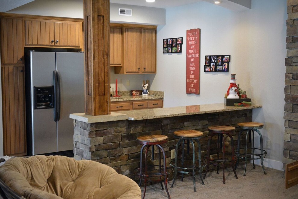 Mid-sized transitional carpeted and brown floor seated home bar photo with light wood cabinets