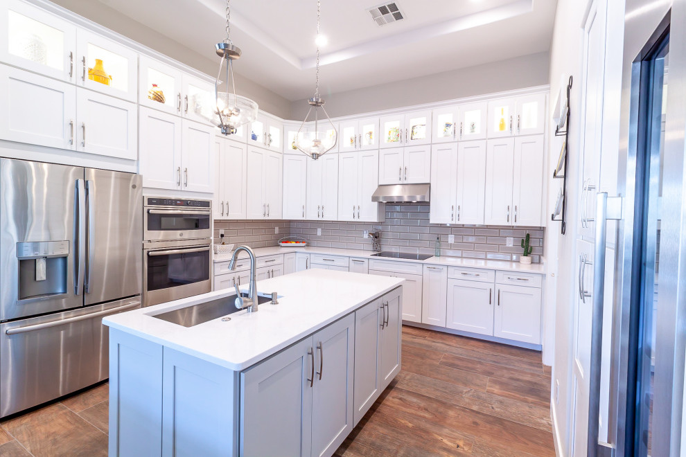 Inspiration for a porcelain tile kitchen remodel in Phoenix with quartzite countertops