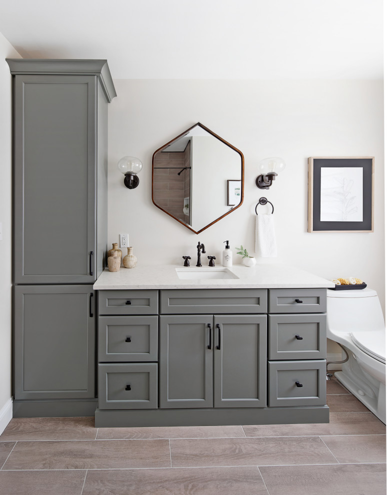 Inspiration for a small transitional kids bathroom in Philadelphia with shaker cabinets, green cabinets, a drop-in tub, a shower/bathtub combo, beige tile, ceramic tile, white walls, ceramic floors, an undermount sink, engineered quartz benchtops, brown floor, a shower curtain, white benchtops, a niche, a single vanity and a built-in vanity.