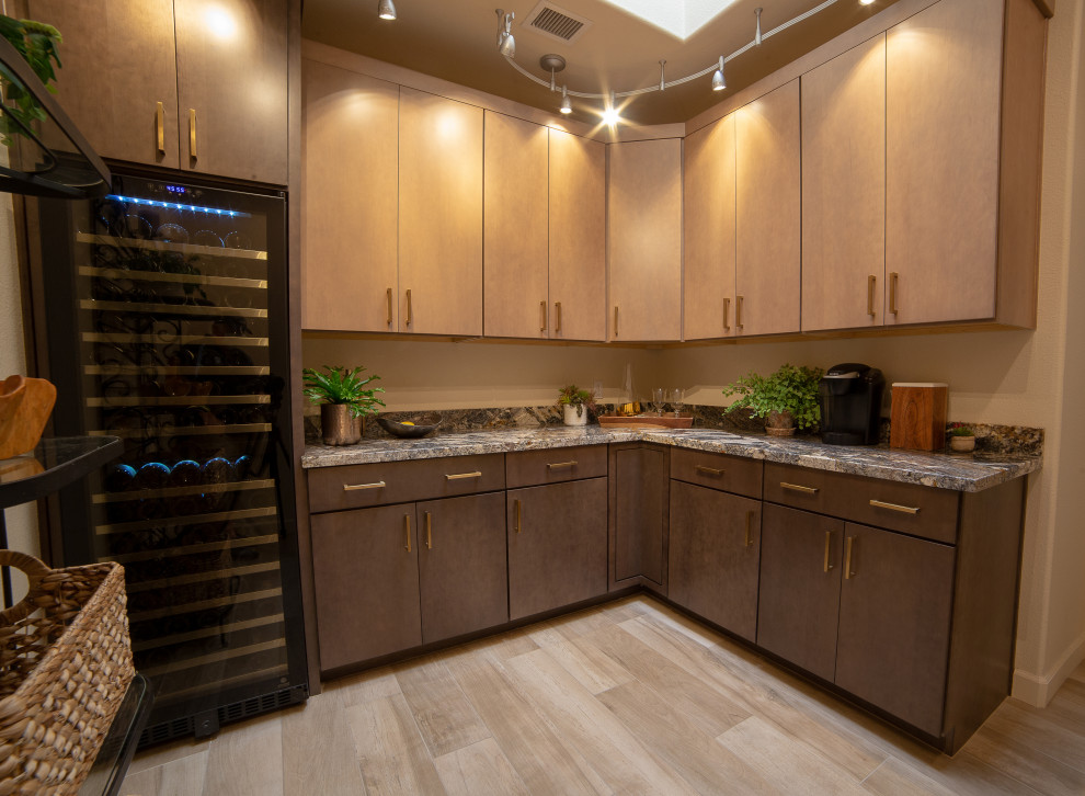 This is an example of an expansive traditional l-shaped utility room in Phoenix with flat-panel cabinets, medium wood cabinets, granite benchtops, porcelain floors and multi-coloured benchtop.
