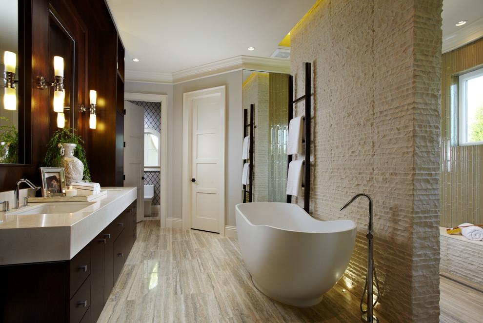 Inspiration for a large transitional master bathroom in Tampa with flat-panel cabinets, a freestanding tub, dark wood cabinets, an open shower, a one-piece toilet, grey walls, porcelain floors, an undermount sink and quartzite benchtops.