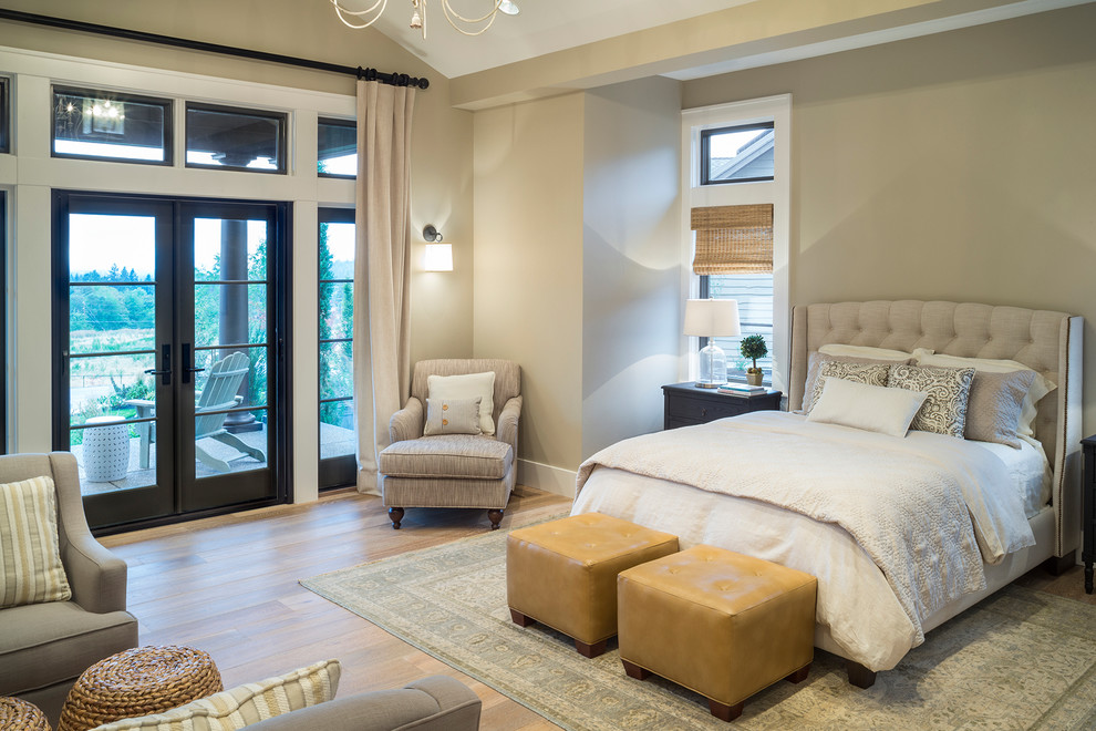 Photo of a transitional master bedroom in Portland with beige walls, light hardwood floors, no fireplace and beige floor.