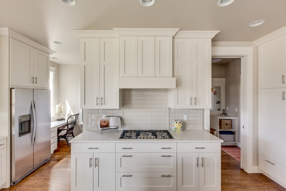 Large transitional light wood floor eat-in kitchen photo in Boise with shaker cabinets, white cabinets, quartzite countertops, stainless steel appliances and an island