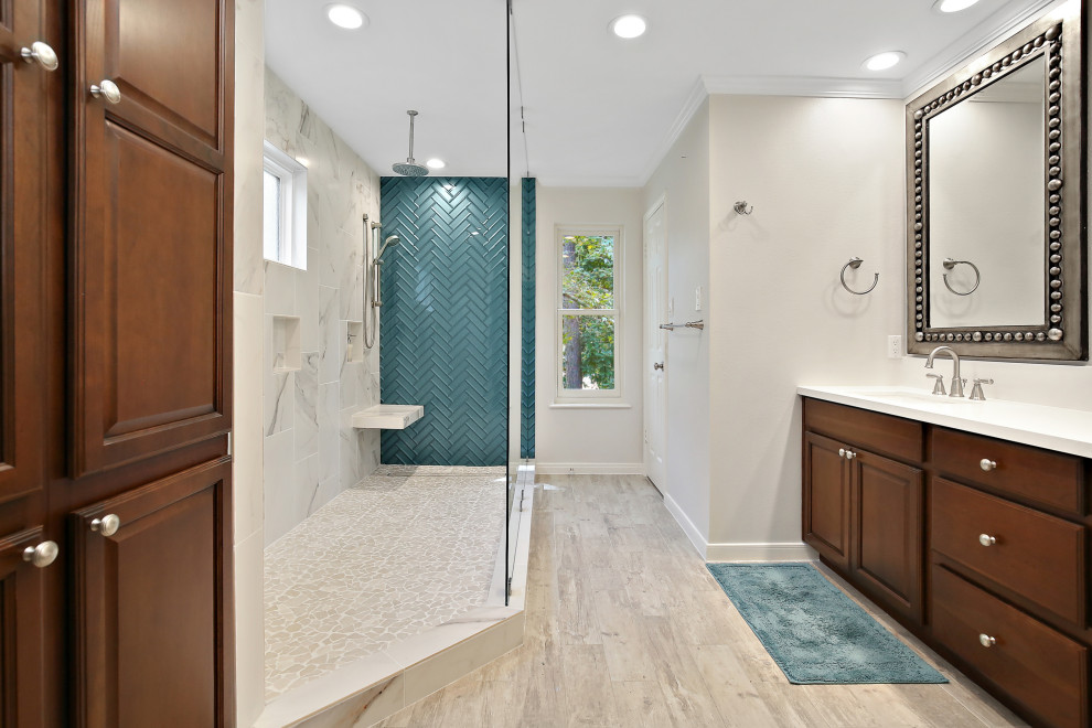Design ideas for a mid-sized transitional master bathroom in Houston with raised-panel cabinets, dark wood cabinets, an open shower, a two-piece toilet, blue tile, glass tile, beige walls, porcelain floors, an undermount sink, engineered quartz benchtops, beige floor, an open shower and white benchtops.