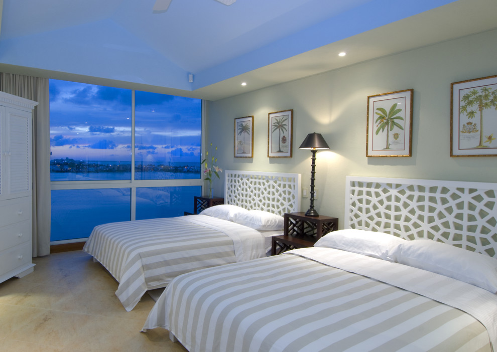 Photo of a tropical guest bedroom in Other with grey walls.