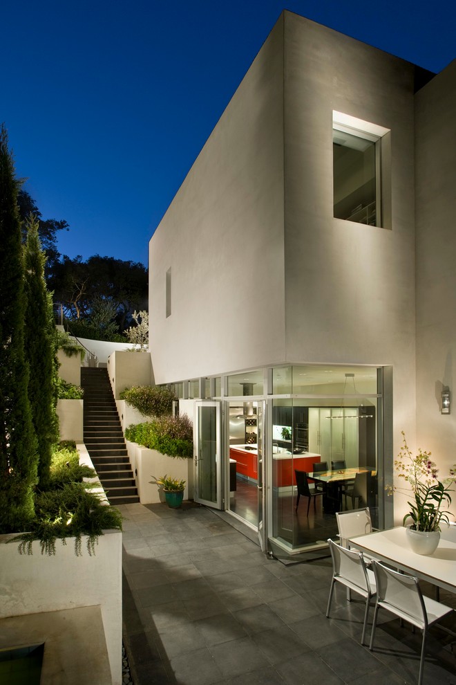 This is an example of a large modern two-storey stucco white house exterior in Santa Barbara with a flat roof.
