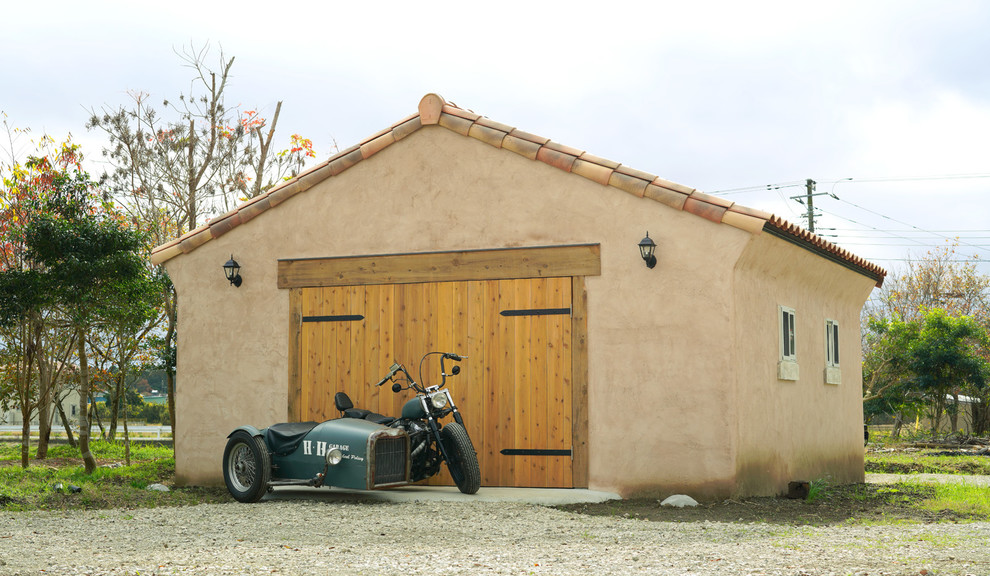 This is an example of a large mediterranean garage in Other.