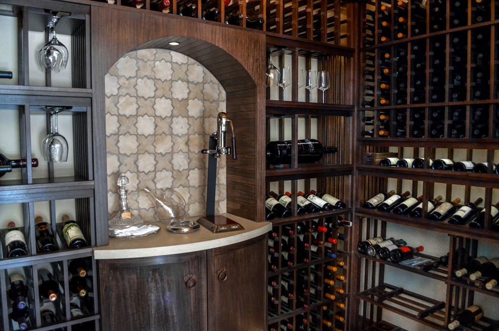 Design ideas for a mid-sized mediterranean wine cellar in San Diego with display racks.