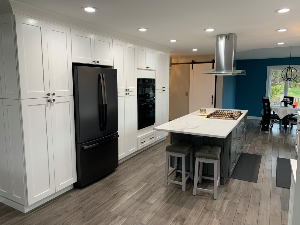 Kitchen - large transitional kitchen idea in Chicago with recessed-panel cabinets, white cabinets and an island