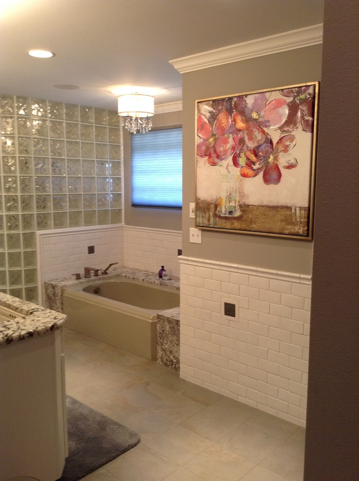 Walk-in shower - mid-sized transitional master white tile and subway tile porcelain tile walk-in shower idea in Seattle with an undermount sink, shaker cabinets, white cabinets, granite countertops, an undermount tub and gray walls