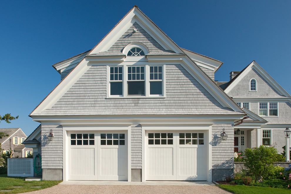 Photo of a large traditional attached two-car garage in Boston.