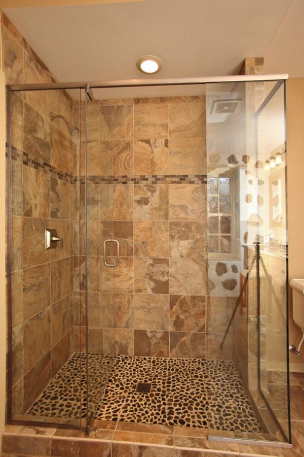 Inspiration for a rustic beige tile and terra-cotta tile ceramic tile drop-in bathtub remodel in Milwaukee with a console sink, shaker cabinets, medium tone wood cabinets, granite countertops, a two-piece toilet and beige walls
