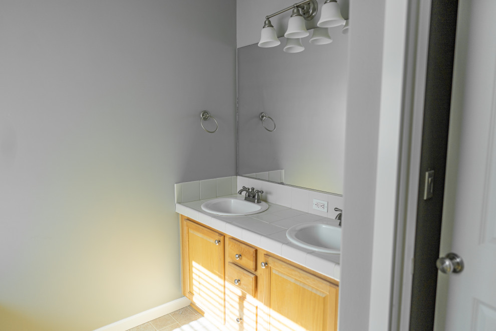 Design ideas for a small modern family bathroom in Seattle with grey walls.