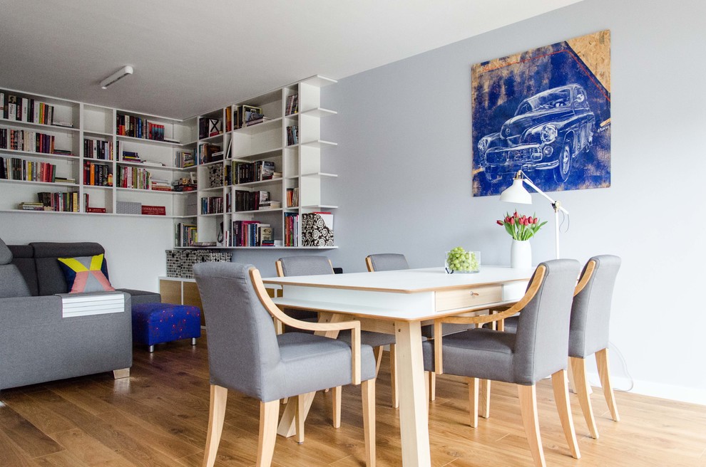 Great room - transitional light wood floor great room idea with gray walls