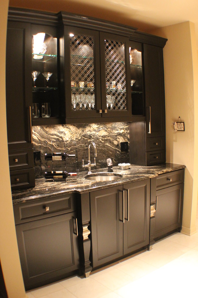 Contemporary single-wall wet bar in Chicago with an undermount sink, recessed-panel cabinets, black cabinets, granite benchtops, multi-coloured splashback, stone slab splashback and linoleum floors.
