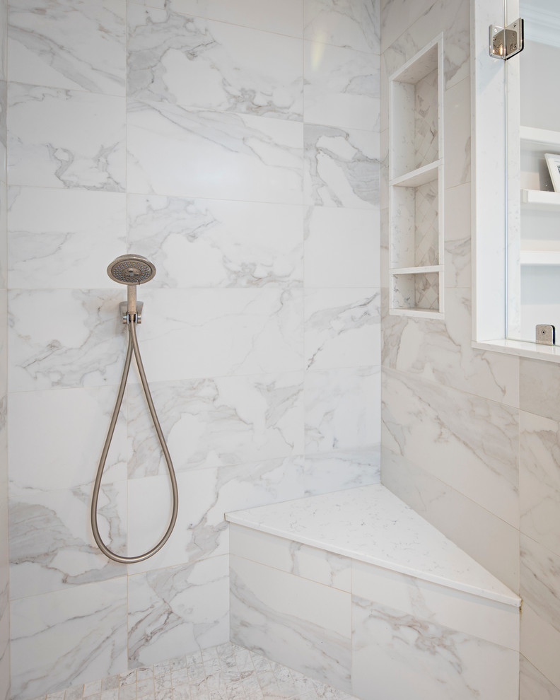Example of a large transitional master gray tile and marble tile porcelain tile and brown floor freestanding bathtub design in New York with shaker cabinets, white cabinets, gray walls, an undermount sink, marble countertops, a hinged shower door and white countertops
