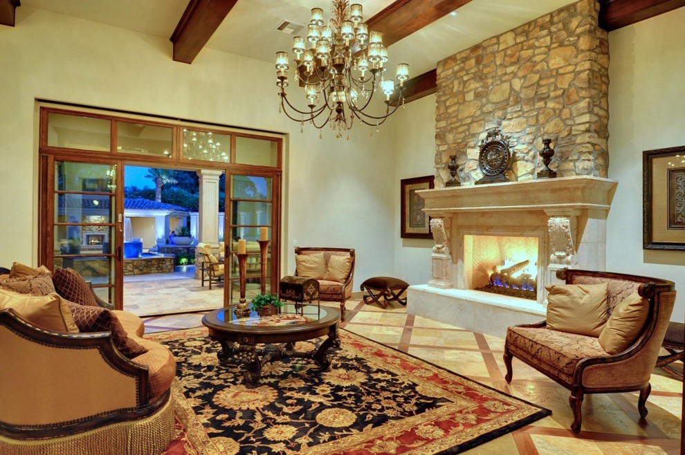 Photo of a mid-sized traditional formal open concept living room in Phoenix with white walls, marble floors, a standard fireplace, a tile fireplace surround, no tv and brown floor.